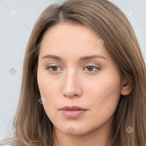 Neutral white young-adult female with long  brown hair and brown eyes