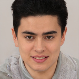 Joyful latino young-adult male with short  brown hair and brown eyes