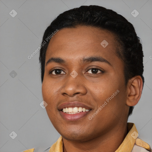 Joyful black young-adult female with short  black hair and brown eyes