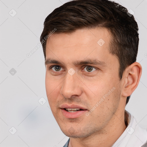 Joyful white young-adult male with short  brown hair and brown eyes