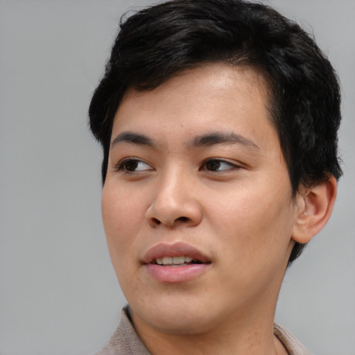 Joyful asian young-adult female with short  black hair and brown eyes