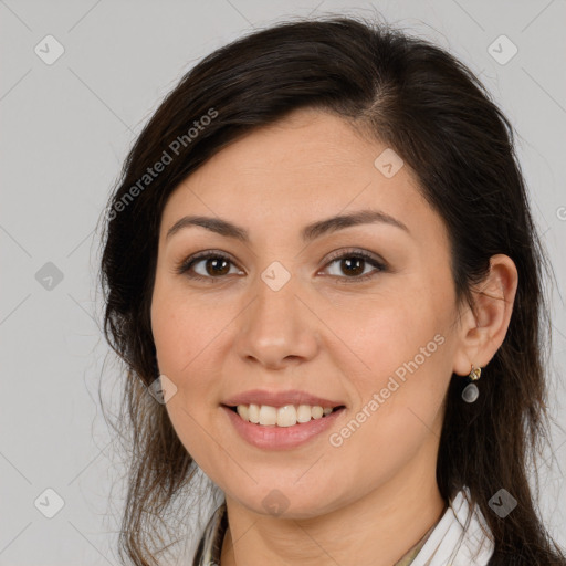 Joyful white young-adult female with long  brown hair and brown eyes