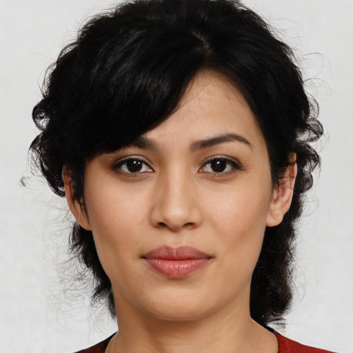 Joyful asian young-adult female with medium  black hair and brown eyes