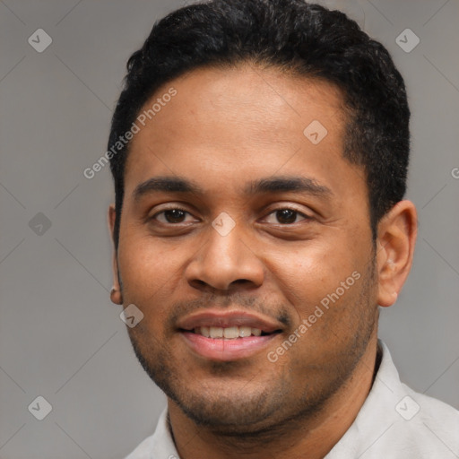 Joyful black young-adult male with short  black hair and brown eyes