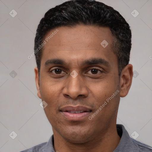 Joyful latino adult male with short  black hair and brown eyes