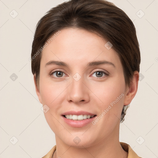 Joyful white young-adult female with short  brown hair and brown eyes