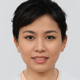 Joyful asian young-adult female with short  brown hair and brown eyes