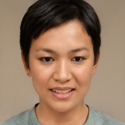 Joyful asian young-adult female with short  black hair and brown eyes