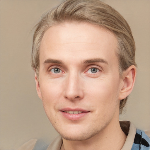 Joyful white adult male with short  brown hair and grey eyes