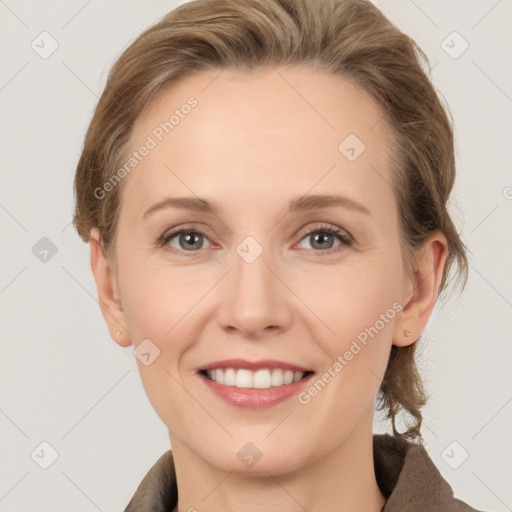 Joyful white adult female with medium  brown hair and grey eyes