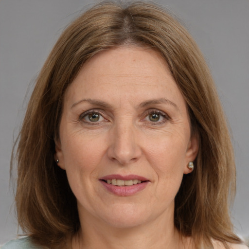 Joyful white adult female with medium  brown hair and brown eyes