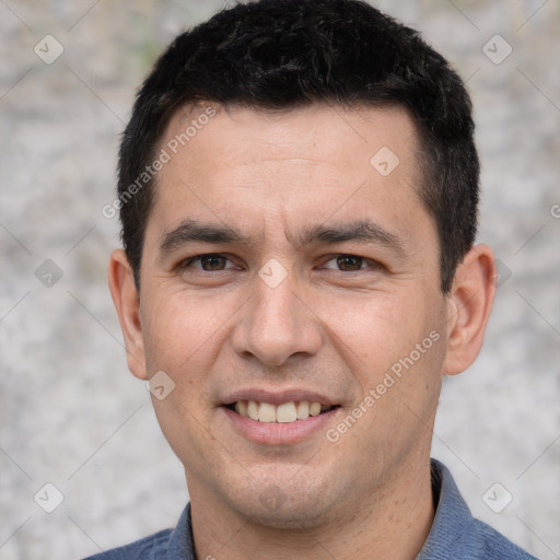 Joyful white young-adult male with short  black hair and brown eyes