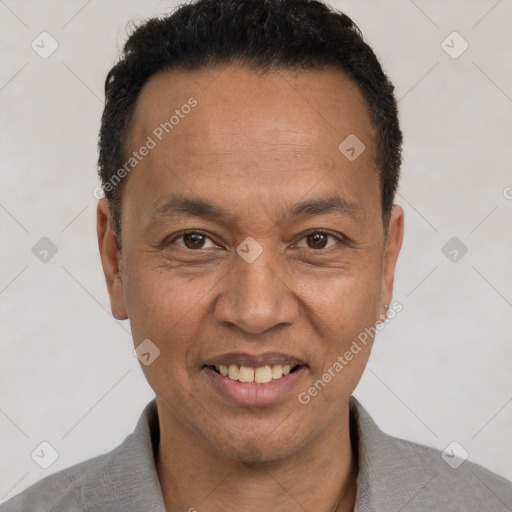 Joyful white adult male with short  black hair and brown eyes