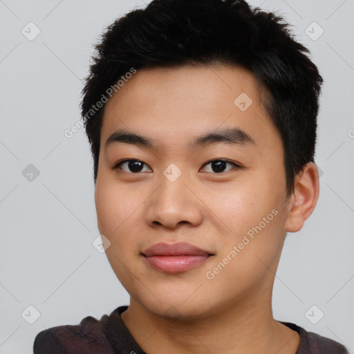 Joyful asian young-adult male with short  black hair and brown eyes