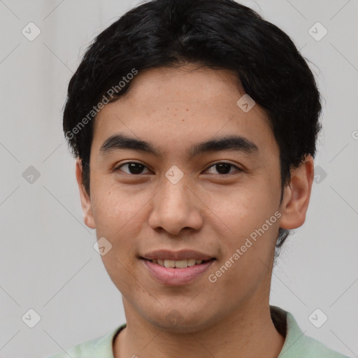 Joyful asian young-adult male with short  black hair and brown eyes