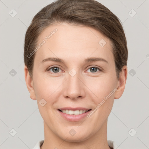 Joyful white young-adult female with short  brown hair and grey eyes