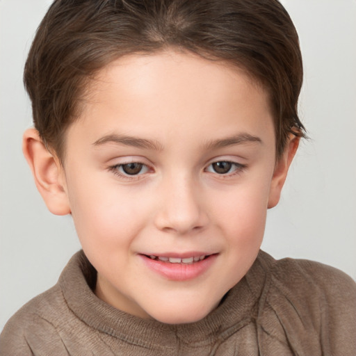 Joyful white child female with short  brown hair and brown eyes