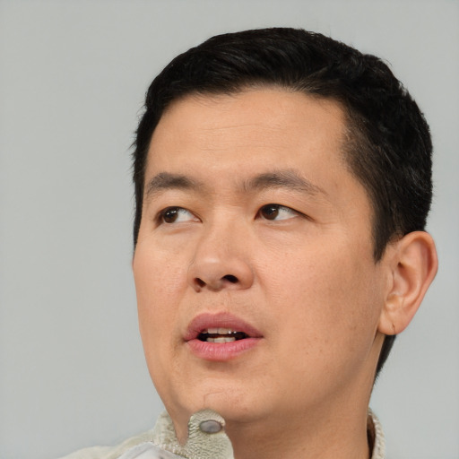 Neutral asian adult male with short  black hair and brown eyes