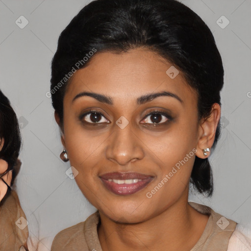 Joyful latino young-adult female with medium  brown hair and brown eyes