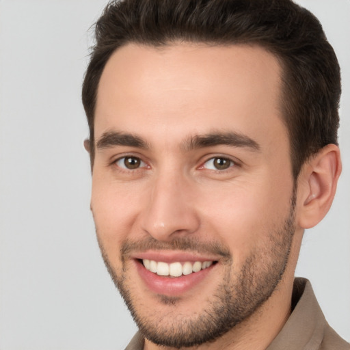 Joyful white young-adult male with short  brown hair and brown eyes