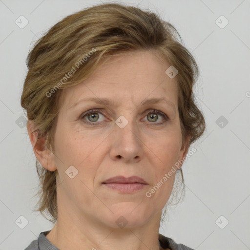 Joyful white adult female with medium  brown hair and grey eyes