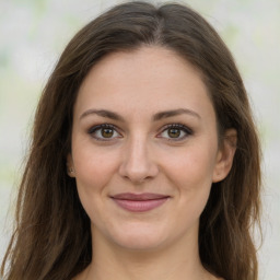 Joyful white young-adult female with long  brown hair and green eyes