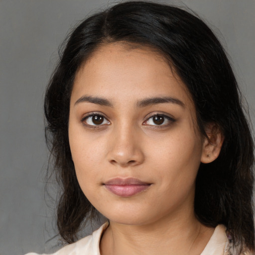Neutral latino young-adult female with medium  black hair and brown eyes