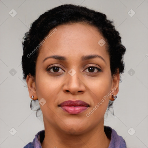 Joyful black young-adult female with long  brown hair and brown eyes