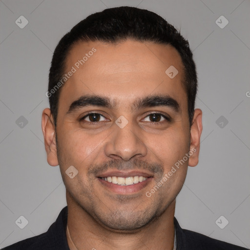 Joyful white young-adult male with short  black hair and brown eyes