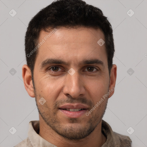 Joyful white young-adult male with short  black hair and brown eyes