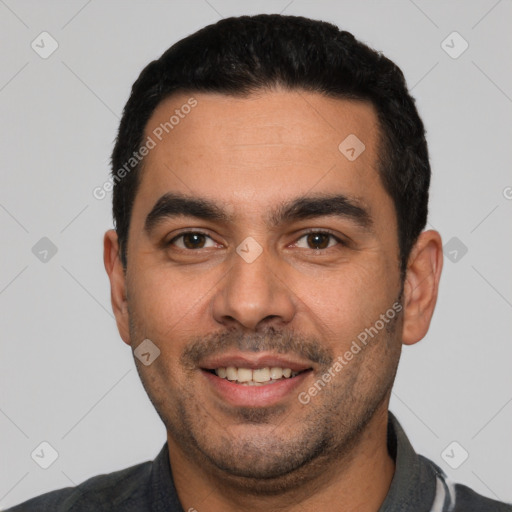 Joyful white young-adult male with short  black hair and brown eyes