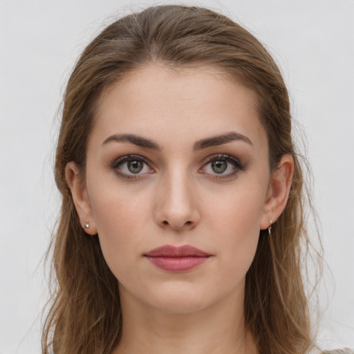 Neutral white young-adult female with long  brown hair and brown eyes