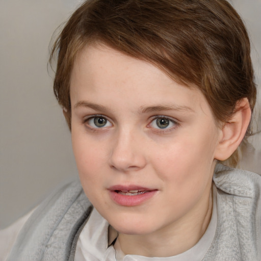 Joyful white young-adult female with short  brown hair and blue eyes