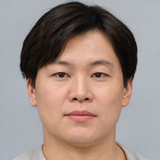 Neutral asian young-adult male with short  brown hair and brown eyes