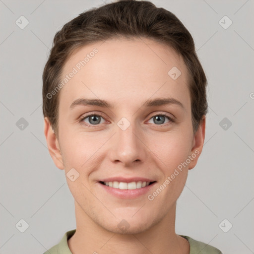 Joyful white young-adult female with short  brown hair and grey eyes