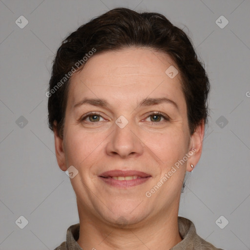 Joyful white adult female with short  brown hair and brown eyes