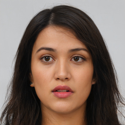 Neutral white young-adult female with long  brown hair and brown eyes