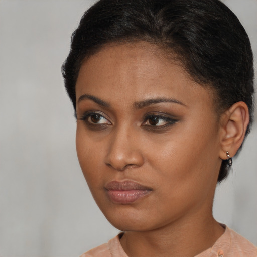 Neutral black young-adult female with short  brown hair and brown eyes