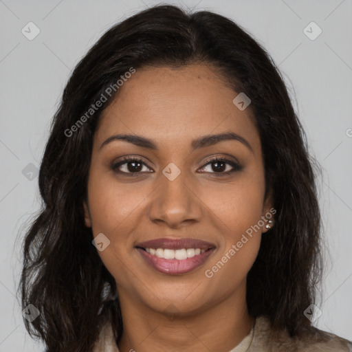 Joyful black young-adult female with long  brown hair and brown eyes