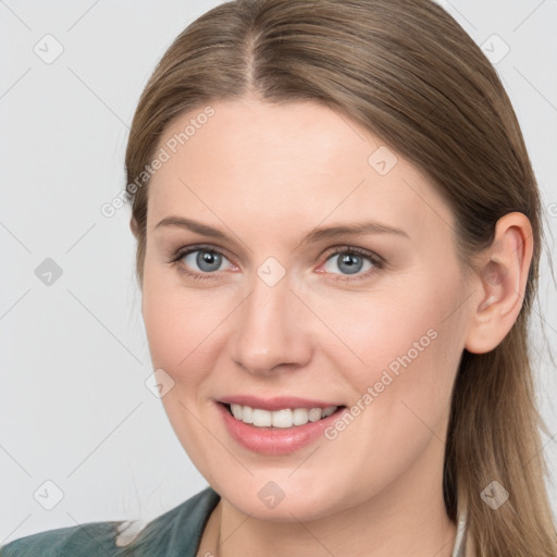 Joyful white young-adult female with medium  brown hair and grey eyes