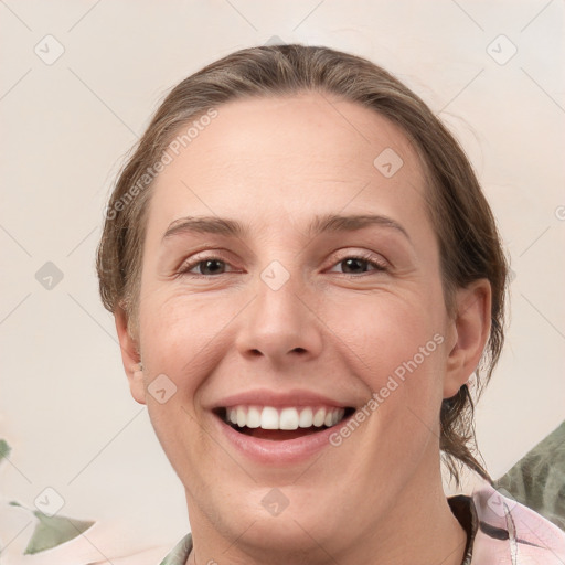 Joyful white young-adult female with medium  brown hair and grey eyes