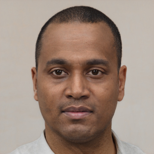 Neutral black young-adult male with short  black hair and brown eyes