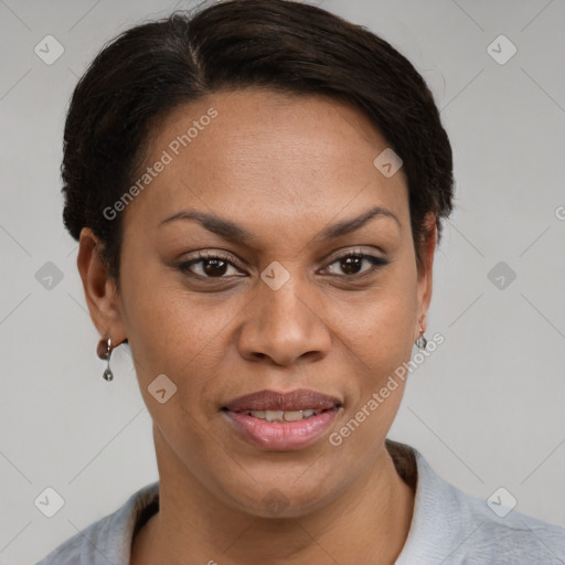 Joyful latino adult female with short  brown hair and brown eyes