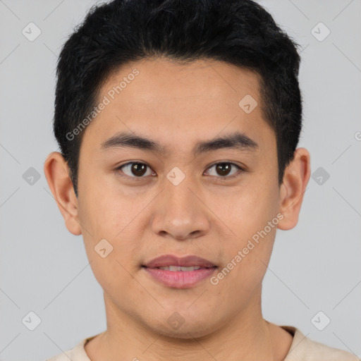 Joyful asian young-adult male with short  black hair and brown eyes