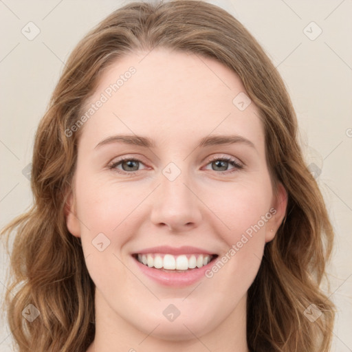 Joyful white young-adult female with long  brown hair and green eyes