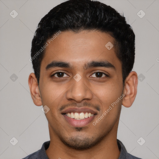 Joyful latino young-adult male with short  black hair and brown eyes