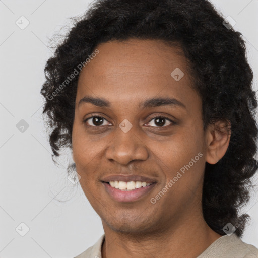 Joyful black young-adult female with long  black hair and brown eyes