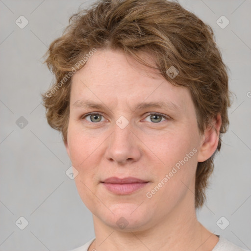 Joyful white adult female with medium  brown hair and blue eyes