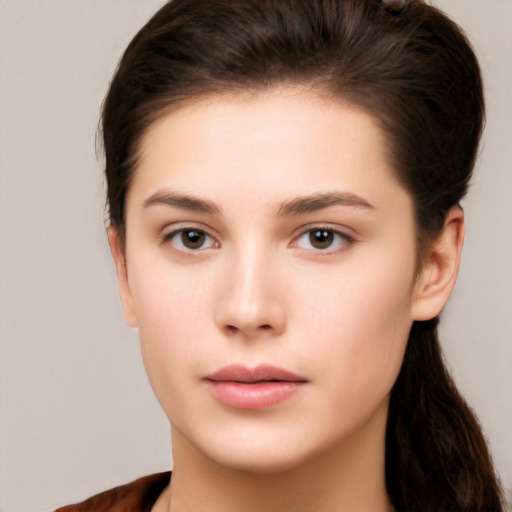 Neutral white young-adult female with long  brown hair and brown eyes