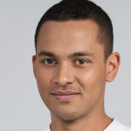 Joyful white young-adult male with short  black hair and brown eyes